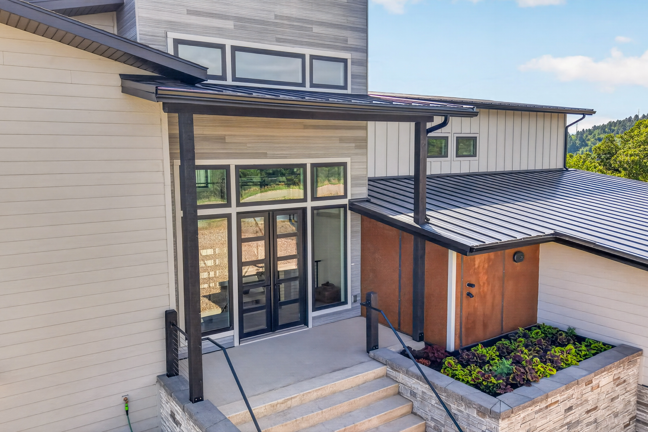 A covered stairway leads to the entry at 2111 Vantage Circle
