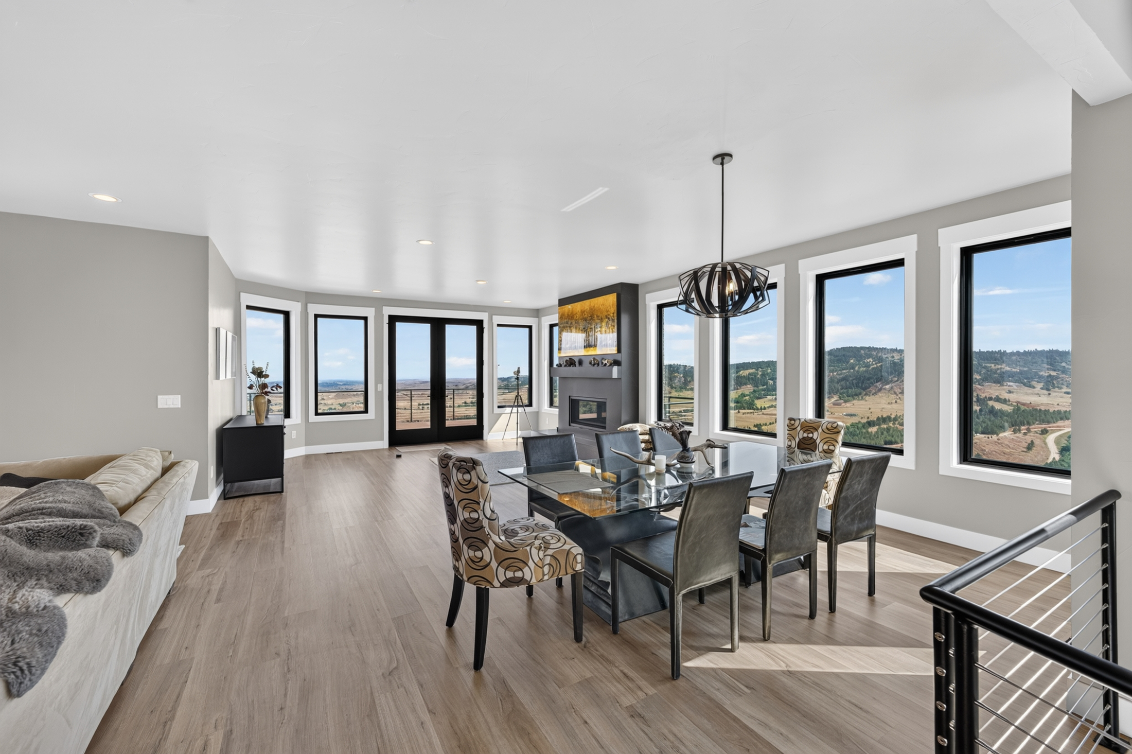 The dining table at 2111 Vantage Circle is set beside a fireplace