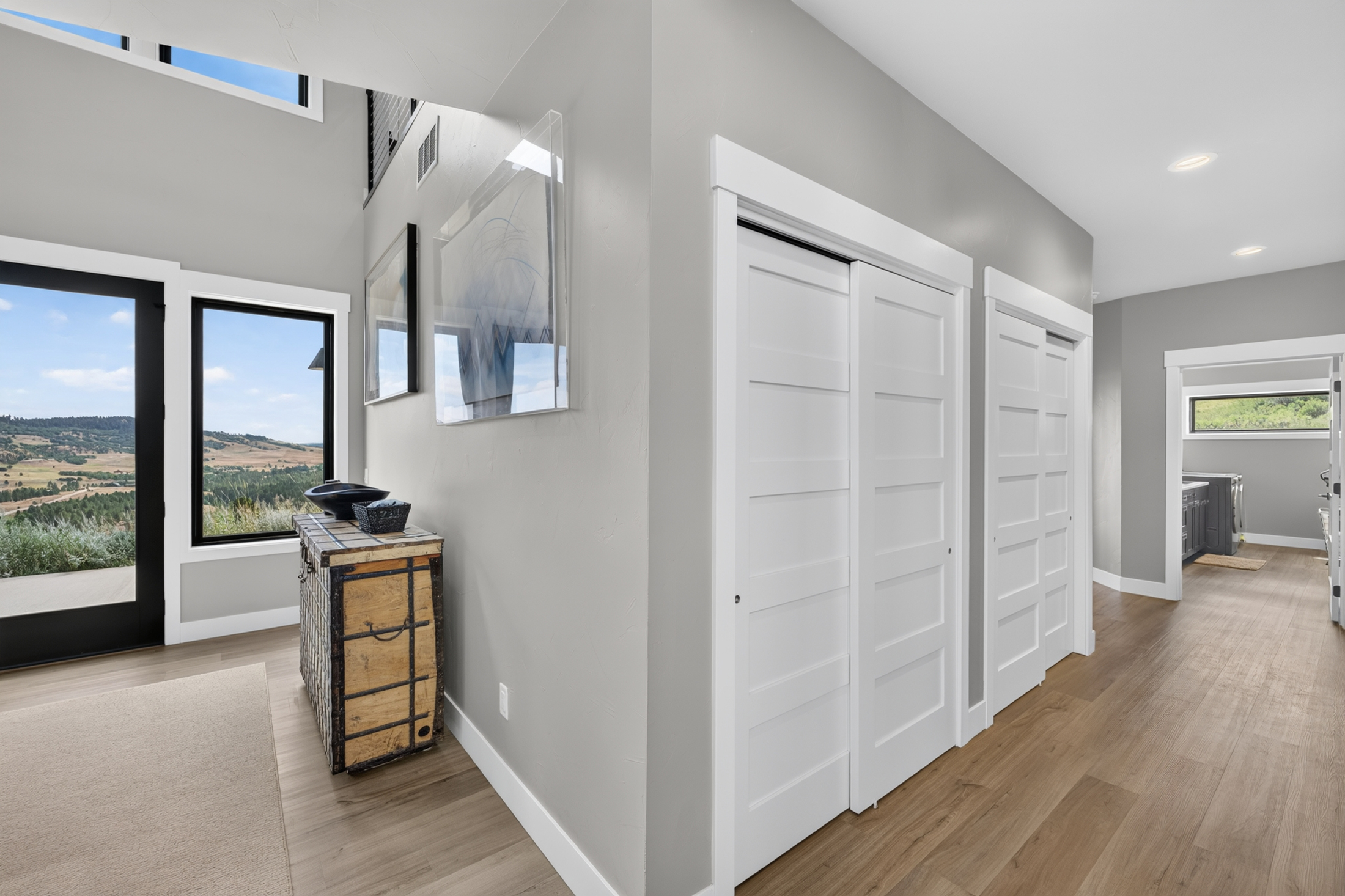 A hallway at 2111 Vantage Circle lined with white sliding closet doors
